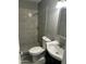 Updated bathroom features a tiled shower and modern fixtures at 1630 N 58Th Ave, Phoenix, AZ 85035