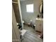 A small bathroom with light gray walls and a vanity with a white cabinet at 1630 N 58Th Ave, Phoenix, AZ 85035