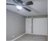 A bedroom with a ceiling fan and hardwood flooring and double closets at 1630 N 58Th Ave, Phoenix, AZ 85035