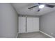 A bedroom with a ceiling fan and hardwood flooring and double closets at 1630 N 58Th Ave, Phoenix, AZ 85035