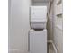 Efficient laundry area with stacked washer and dryer for space-saving convenience at 1630 N 58Th Ave, Phoenix, AZ 85035