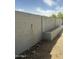 Side yard with the tall block fence provides privacy to the property at 1630 N 58Th Ave, Phoenix, AZ 85035