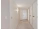 Neutral hallway featuring carpet, tile, and access to bedrooms and common areas at 17247 N 106Th Ave, Sun City, AZ 85373