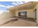 Covered patio with sliding glass doors provides seamless indoor-outdoor living at 17247 N 106Th Ave, Sun City, AZ 85373