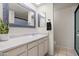 Well-lit bathroom featuring a vanity with marble countertops and a framed mirror at 18 N 132Nd St, Chandler, AZ 85225