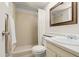 Functional bathroom with tiled walk-in shower, modern fixtures, and ample lighting at 18 N 132Nd St, Chandler, AZ 85225