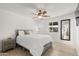 Bright bedroom with wood floors, ceiling fan, and natural light from the window at 18 N 132Nd St, Chandler, AZ 85225