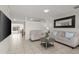 Inviting living room featuring neutral tones, tiled floors, and comfortable seating at 18 N 132Nd St, Chandler, AZ 85225