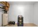 Storage area with water heater and stacked toolboxes in a well-lit space at 18 N 132Nd St, Chandler, AZ 85225