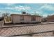 Fenced backyard of a modest home with a view of the exterior at 1813 W Tamarisk St, Phoenix, AZ 85041