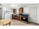 Bright kitchen featuring wooden cabinets, tile floors, and modern appliances at 1813 W Tamarisk St, Phoenix, AZ 85041