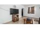 Living room featuring tile floors, a television, and doorway at 1813 W Tamarisk St, Phoenix, AZ 85041