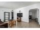 Living room featuring tile floors, minimalist furniture, and open layout at 1813 W Tamarisk St, Phoenix, AZ 85041