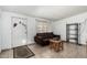 Cozy living room with tile floors, a brown sofa, and natural light at 1813 W Tamarisk St, Phoenix, AZ 85041