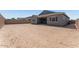 Spacious backyard with covered patio and potential for landscaping at 19094 E Broadmoor Trl, Queen Creek, AZ 85142