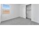 Bright bedroom features a closet and a window at 19094 E Broadmoor Trl, Queen Creek, AZ 85142