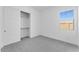 Bright bedroom features a closet and a window at 19094 E Broadmoor Trl, Queen Creek, AZ 85142