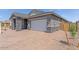 Charming single story home featuring a stylish stone exterior, brick driveway, and two car garage at 19094 E Broadmoor Trl, Queen Creek, AZ 85142