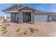 Charming single-story home with stone accents and low-maintenance landscaping at 19094 E Broadmoor Trl, Queen Creek, AZ 85142