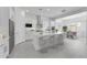 Bright, modern kitchen with white cabinets, stainless steel appliances, and an island with seating at 19094 E Broadmoor Trl, Queen Creek, AZ 85142
