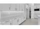 Contemporary kitchen featuring white cabinetry, modern backsplash, and stainless steel appliances at 19094 E Broadmoor Trl, Queen Creek, AZ 85142