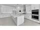 Spacious kitchen with stainless appliances, a large island, and sleek white cabinetry at 19094 E Broadmoor Trl, Queen Creek, AZ 85142