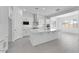 Modern kitchen with a center island, stainless steel range hood, and white cabinets at 19094 E Broadmoor Trl, Queen Creek, AZ 85142