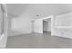 Bright living room with gray tile flooring and white walls and cabinets at 19094 E Broadmoor Trl, Queen Creek, AZ 85142