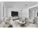 Stylishly furnished living room with modern decor, TV, and ample seating at 19094 E Broadmoor Trl, Queen Creek, AZ 85142