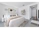 Main bedroom with a large bed, decor shelves, and a stylish rug at 19094 E Broadmoor Trl, Queen Creek, AZ 85142