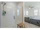 Modern bathroom with a frameless glass shower door and tiled walls, offering a clean and contemporary look at 1915 W Hide Trl, Phoenix, AZ 85085