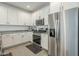 Modern kitchen featuring stainless steel appliances and bright cabinetry at 1915 W Hide Trl, Phoenix, AZ 85085