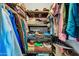 Neatly arranged walk-in closet with shelving and hanging space for clothes and shoes at 20006 N Concho Cir, Sun City, AZ 85373