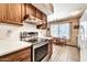 This functional kitchen features modern stainless steel appliances and ample counter space at 20006 N Concho Cir, Sun City, AZ 85373