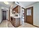 Efficient kitchen featuring a modern stainless steel stove and ample storage within dark wood cabinets at 20006 N Concho Cir, Sun City, AZ 85373