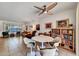 Spacious living area featuring a dining table, ceiling fan and an abundance of natural light at 20006 N Concho Cir, Sun City, AZ 85373