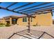 Enjoy outdoor living in this gravel backyard with pergola and covered patio at 2019 E Entoro Dr, Casa Grande, AZ 85122