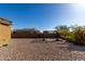 Gravel yard with a pergola, offering a unique outdoor space for relaxation and entertainment at 2019 E Entoro Dr, Casa Grande, AZ 85122