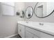 Bathroom featuring double sinks and round mirrors at 2019 E Entoro Dr, Casa Grande, AZ 85122