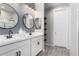 Bathroom features a double sink vanity, modern fixtures, and stylish tile flooring at 2019 E Entoro Dr, Casa Grande, AZ 85122