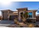 Beautiful single-Gathering home with a well-manicured front yard and a three-car garage at 2019 E Entoro Dr, Casa Grande, AZ 85122