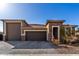 Beautiful single-Gathering home with a well-manicured front yard and a three-car garage at 2019 E Entoro Dr, Casa Grande, AZ 85122