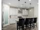 Modern kitchen featuring white cabinetry, a large island with seating, and stainless steel appliances at 2019 E Entoro Dr, Casa Grande, AZ 85122