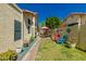 Landscaped backyard with desert plants, paver path, and colorful seating area at 21 W Ranch Rd, Tempe, AZ 85284