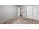 Bedroom featuring carpeted floors, closet doors, and neutral gray paint at 21 W Ranch Rd, Tempe, AZ 85284