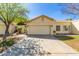 Charming single-story home featuring a two-car garage and a well-manicured front yard at 21 W Ranch Rd, Tempe, AZ 85284