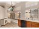 Sunlit kitchen nook featuring light tile floors, an array of windows, and ample countertop space at 21 W Ranch Rd, Tempe, AZ 85284