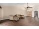 Comfortable living room features wood floors, neutral colors, and a ceiling fan at 21 W Ranch Rd, Tempe, AZ 85284