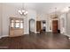 Bright and airy living room with wood floors, open doorways, and natural light at 21 W Ranch Rd, Tempe, AZ 85284