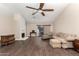 Bright living room with a fireplace, wood floors, and a sliding door to the outside at 21 W Ranch Rd, Tempe, AZ 85284